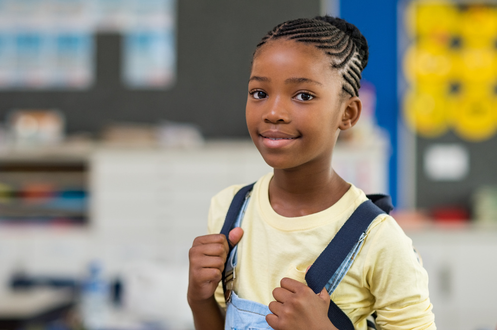Girl Wearing Backpack at School